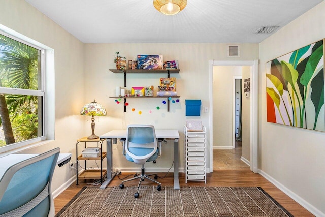 3064 Rostan Ln, Palm Springs, FL 33461 - home office featuring wood finished floors and baseboards