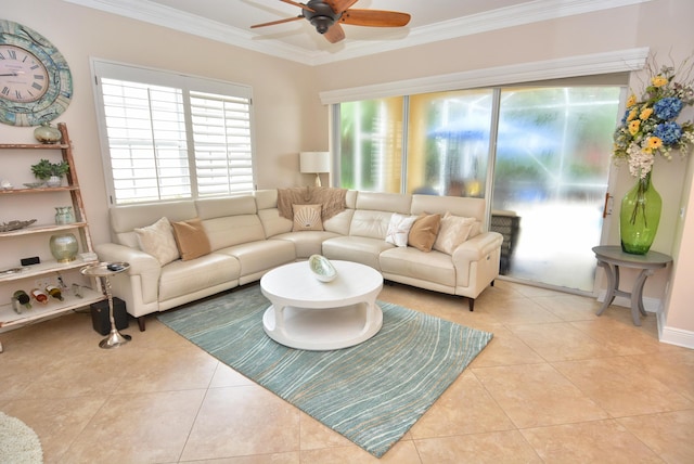 tiled living room with ornamental molding and a ceiling fan