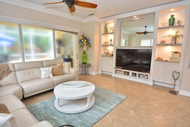 living area with a ceiling fan, ornamental molding, light tile patterned floors, baseboards, and built in shelves