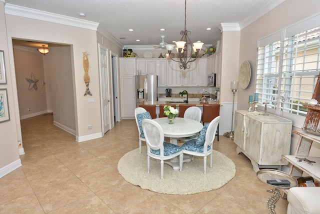 dining space with a chandelier, ornamental molding, light tile patterned flooring, recessed lighting, and baseboards