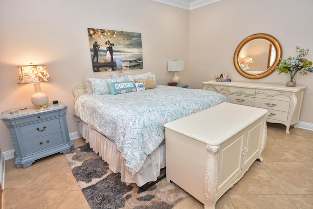 bedroom with light tile patterned floors, ornamental molding, and baseboards