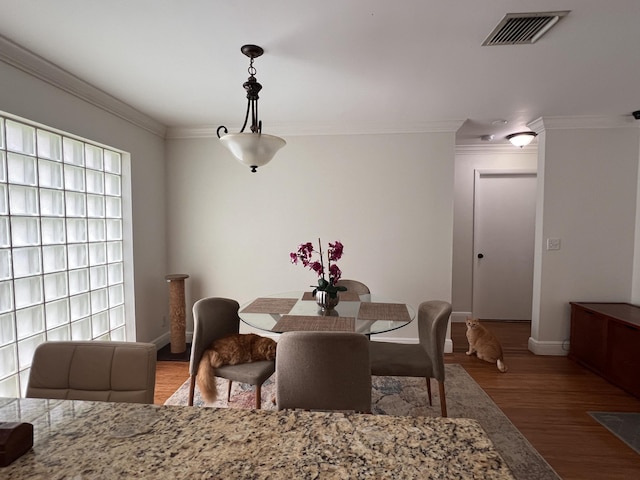 12147 Cuddington Ct, Wellington, FL 33414 - dining room with crown molding, wood finished floors, and baseboards