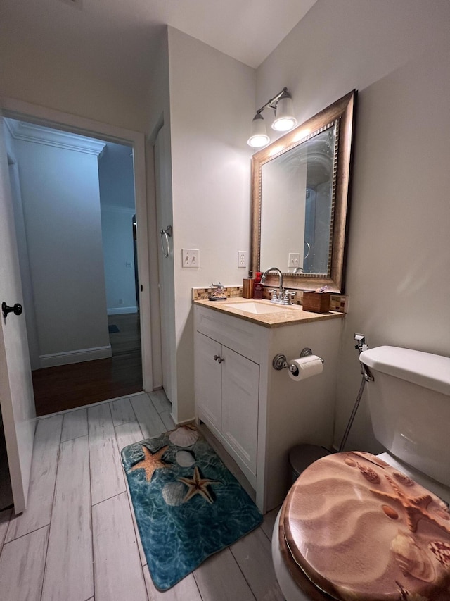 12147 Cuddington Ct, Wellington, FL 33414 - bathroom featuring wood finished floors, toilet, and vanity
