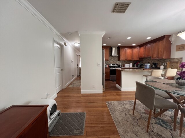 12147 Cuddington Ct, Wellington, FL 33414 - dining space featuring crown molding, recessed lighting, light wood finished floors, and baseboards