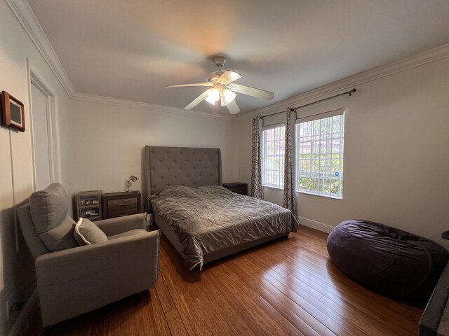 12147 Cuddington Ct, Wellington, FL 33414 - bedroom featuring wood-type flooring, crown molding, baseboards, and a ceiling fan