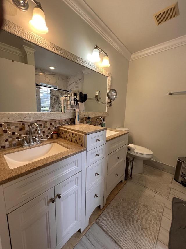 12147 Cuddington Ct, Wellington, FL 33414 - full bathroom with decorative backsplash, ornamental molding, a shower with shower door, toilet, and vanity