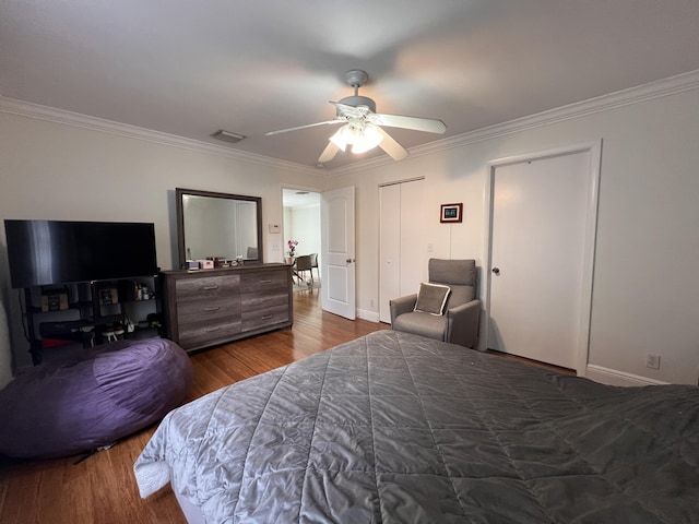 12147 Cuddington Ct, Wellington, FL 33414 - bedroom with crown molding, dark wood-style flooring, ceiling fan, and baseboards