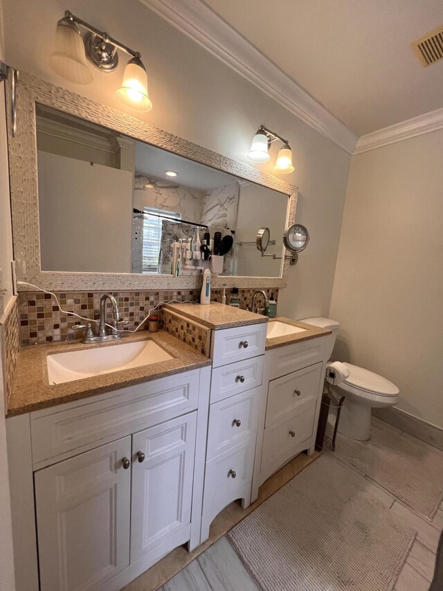 12147 Cuddington Ct, Wellington, FL 33414 - bathroom featuring ornamental molding, toilet, an enclosed shower, double vanity, and tasteful backsplash