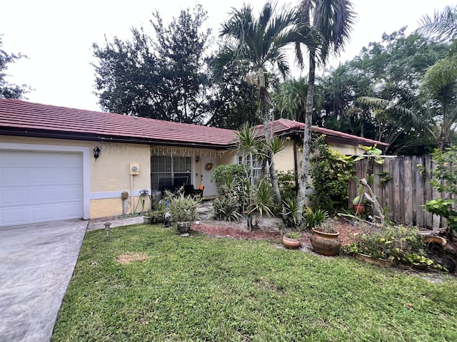 12147 Cuddington Ct, Wellington, FL 33414 - ranch-style house featuring stucco siding, a tile roof, an attached garage, and concrete driveway