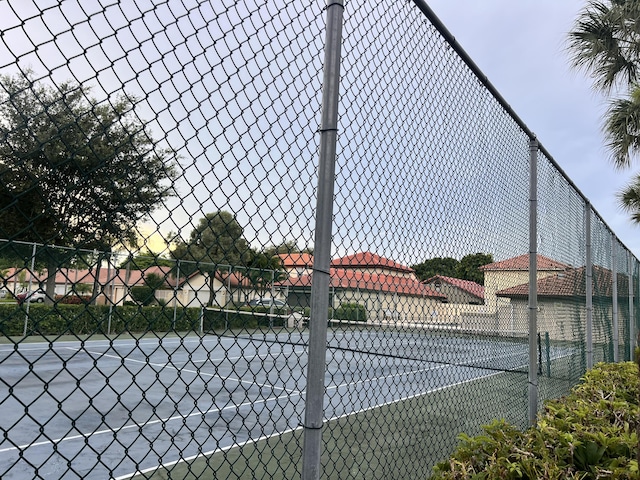 12147 Cuddington Ct, Wellington, FL 33414 - view of tennis court featuring fence