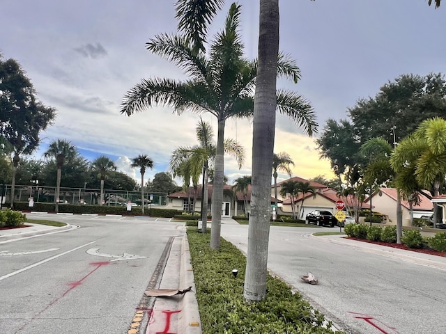 12147 Cuddington Ct, Wellington, FL 33414 - view of asphalt street with curbs and traffic signs