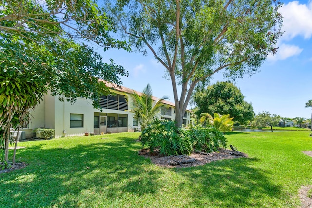 3 Via De Casas Sur Unit 204, Boynton Beach, FL 33426 - view of grassy yard with a water view and central AC
