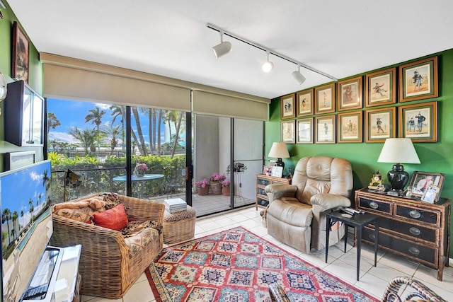 3701 S Flagler Dr Unit A101, West Palm Beach, FL 33405 - living room featuring light tile patterned flooring and rail lighting