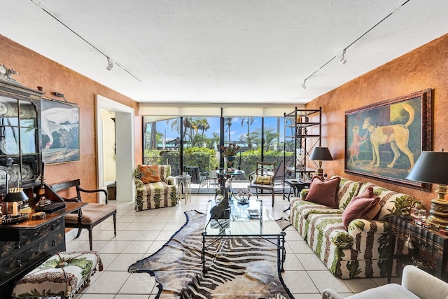 3701 S Flagler Dr Unit A101, West Palm Beach, FL 33405 - tiled living area featuring track lighting and a textured wall