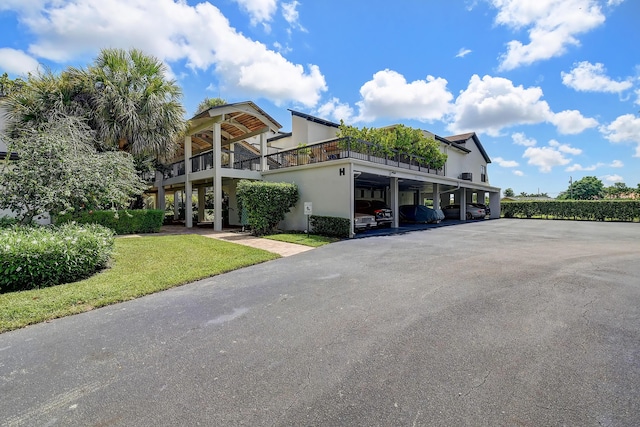 830 Greensward Ct Unit 107-H, Delray Beach, FL 33445 - view of property with covered parking