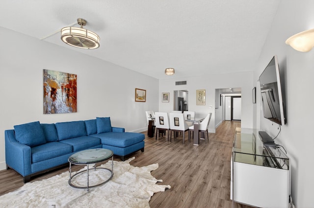 830 Greensward Ct Unit 107-H, Delray Beach, FL 33445 - living area featuring wood finished floors and baseboards