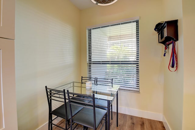 830 Greensward Ct Unit 107-H, Delray Beach, FL 33445 - dining area with baseboards and wood finished floors