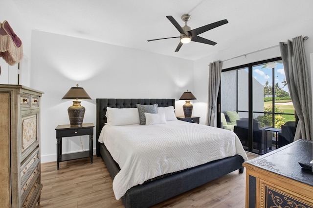 830 Greensward Ct Unit 107-H, Delray Beach, FL 33445 - bedroom featuring access to outside, light wood-style flooring, and ceiling fan