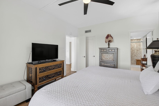 830 Greensward Ct Unit 107-H, Delray Beach, FL 33445 - bedroom featuring ceiling fan, connected bathroom, and wood finished floors