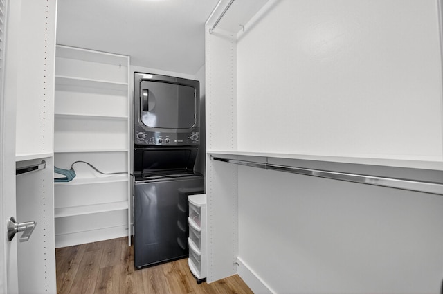 830 Greensward Ct Unit 107-H, Delray Beach, FL 33445 - spacious closet with estacked washer and dryer and wood finished floors