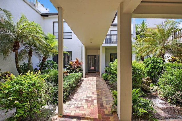 830 Greensward Ct Unit 107-H, Delray Beach, FL 33445 - entrance to property with stucco siding and a balcony