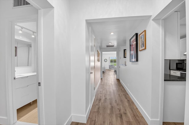 830 Greensward Ct Unit 107-H, Delray Beach, FL 33445 - hall with wood finished floors and recessed lighting