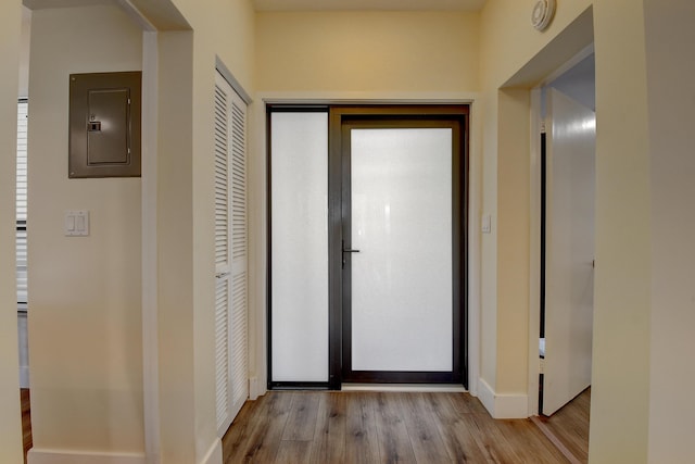 830 Greensward Ct Unit 107-H, Delray Beach, FL 33445 - hall featuring electric panel, wood finished floors, and baseboards