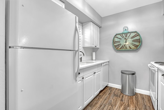 12003 Poinciana Blvd Unit 102, Royal Palm Beach, FL 33411 - kitchen featuring white appliances, dark wood-type flooring, white cabinetry, and light countertops