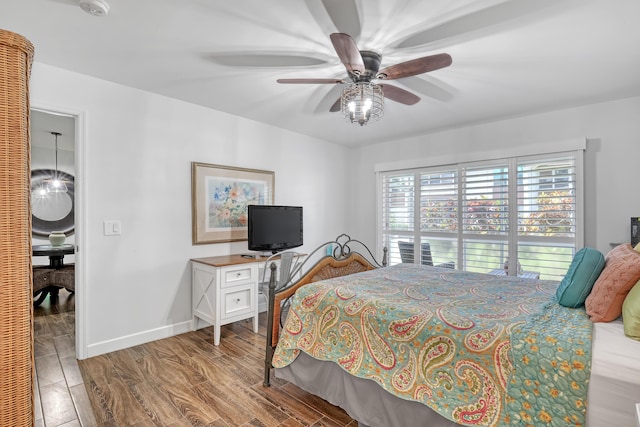 12003 Poinciana Blvd Unit 102, Royal Palm Beach, FL 33411 - bedroom featuring wood finished floors, a closet, ceiling fan, and a spacious closet