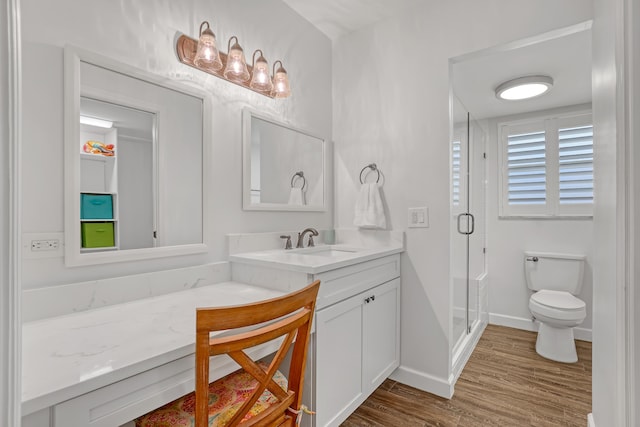 12003 Poinciana Blvd Unit 102, Royal Palm Beach, FL 33411 - bathroom with vanity, a shower stall, and wood finished floors