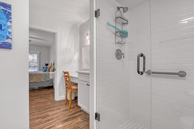 12003 Poinciana Blvd Unit 102, Royal Palm Beach, FL 33411 - ensuite bathroom with a shower stall, wood finished floors, and vanity