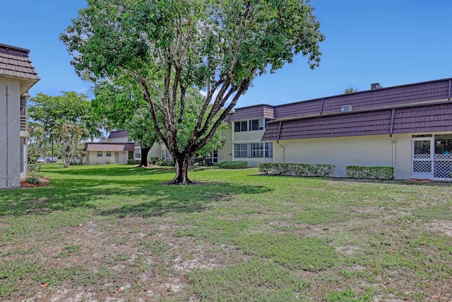 12003 Poinciana Blvd Unit 102, Royal Palm Beach, FL 33411 - view of green lawn