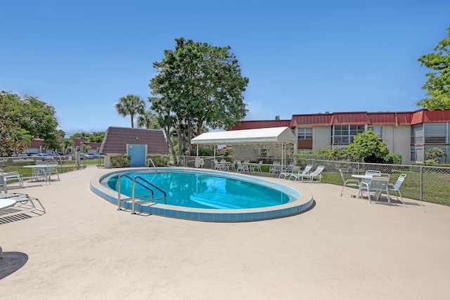 12003 Poinciana Blvd Unit 102, Royal Palm Beach, FL 33411 - community pool with a patio area