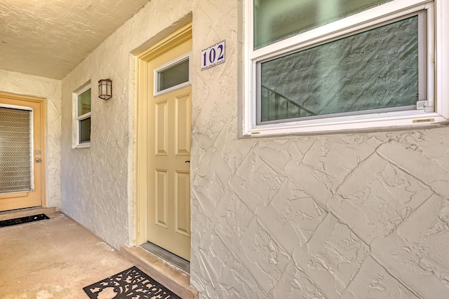 12003 Poinciana Blvd Unit 102, Royal Palm Beach, FL 33411 - doorway to property featuring stucco siding