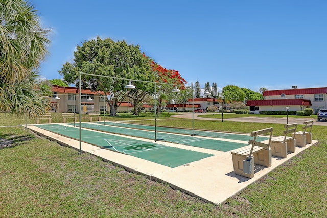 12003 Poinciana Blvd Unit 102, Royal Palm Beach, FL 33411 - surrounding community with shuffleboard and a lawn