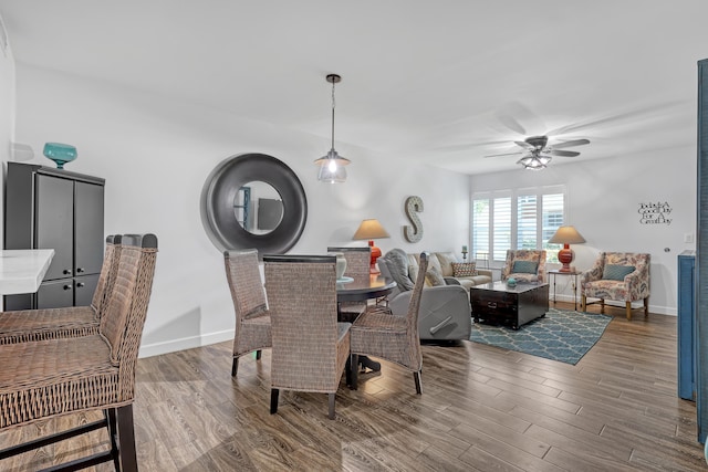 12003 Poinciana Blvd Unit 102, Royal Palm Beach, FL 33411 - dining space featuring a ceiling fan and wood finished floors