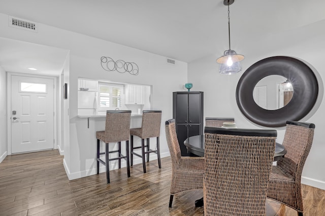 12003 Poinciana Blvd Unit 102, Royal Palm Beach, FL 33411 - dining space with wood finished floors and baseboards