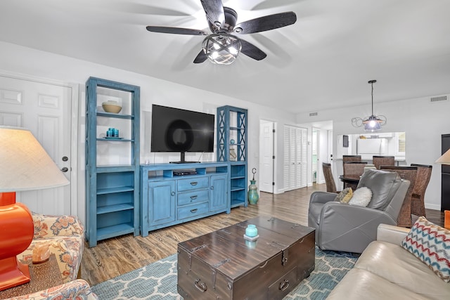 12003 Poinciana Blvd Unit 102, Royal Palm Beach, FL 33411 - living area with ceiling fan and wood finished floors