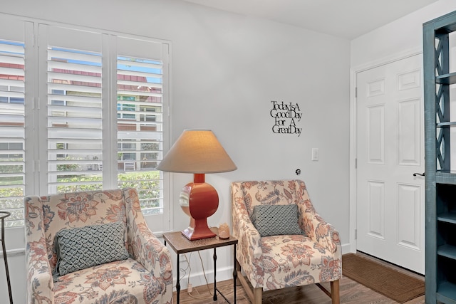 12003 Poinciana Blvd Unit 102, Royal Palm Beach, FL 33411 - sitting room with healthy amount of natural light and wood finished floors