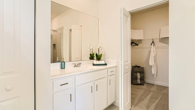 555 SE Rivergrass St, Port Saint Lucie, FL 34984 - full bath featuring a spacious closet, vanity, and a stall shower