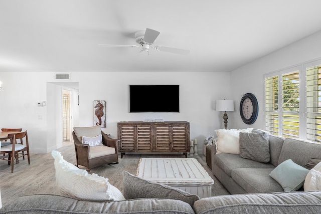 1045 Circle Ter E Unit D, Delray Beach, FL 33445 - living area featuring wood finished floors, a ceiling fan, and baseboards