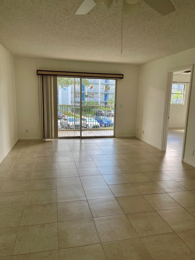 650 SW 124th Ter Unit 202P, Pembroke Pines, FL 33027 - spare room with ceiling fan, a textured ceiling, and light tile patterned floors