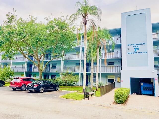 650 SW 124th Ter Unit 202P, Pembroke Pines, FL 33027 - view of building exterior featuring uncovered parking