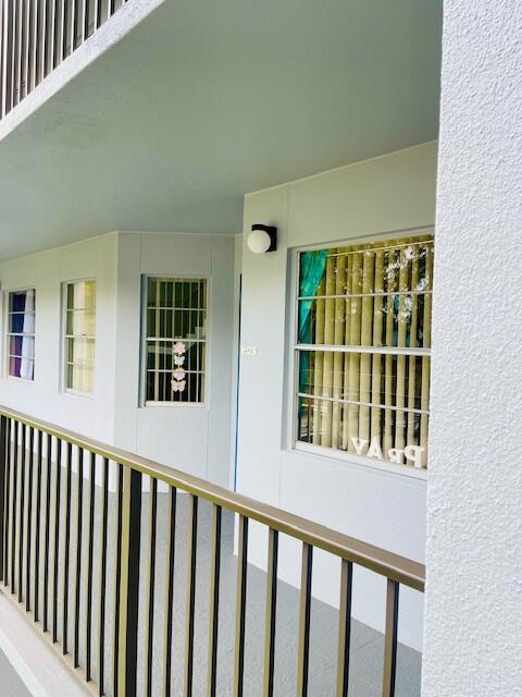 650 SW 124th Ter Unit 202P, Pembroke Pines, FL 33027 - view of exterior entry featuring stucco siding