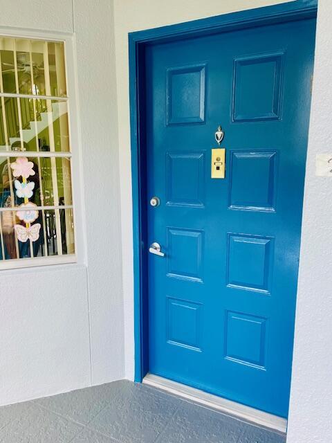 650 SW 124th Ter Unit 202P, Pembroke Pines, FL 33027 - property entrance with stucco siding