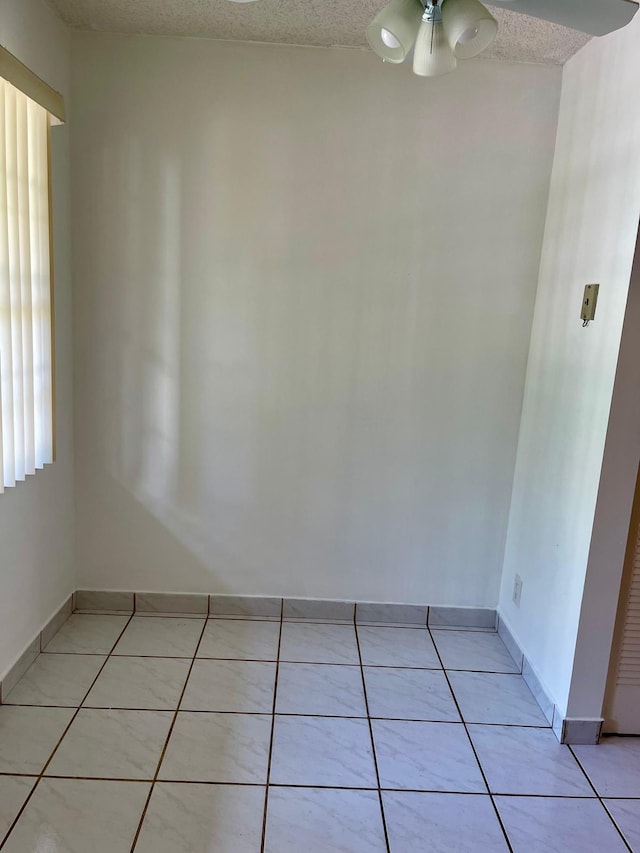 650 SW 124th Ter Unit 202P, Pembroke Pines, FL 33027 - unfurnished room featuring light tile patterned floors, ceiling fan, baseboards, and a textured ceiling