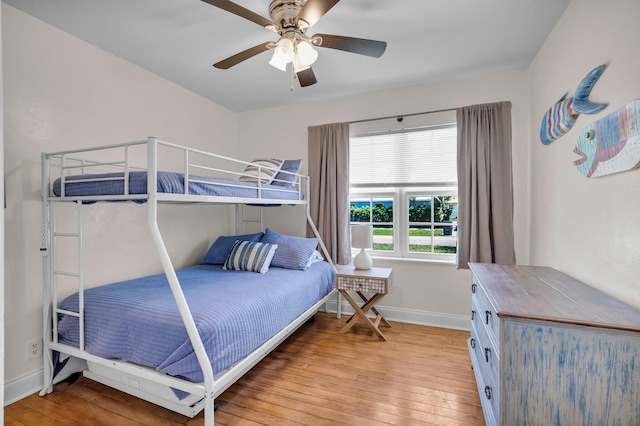 301 SW 1st Ave, Delray Beach, FL 33444 - bedroom with baseboards, wood-type flooring, and a ceiling fan
