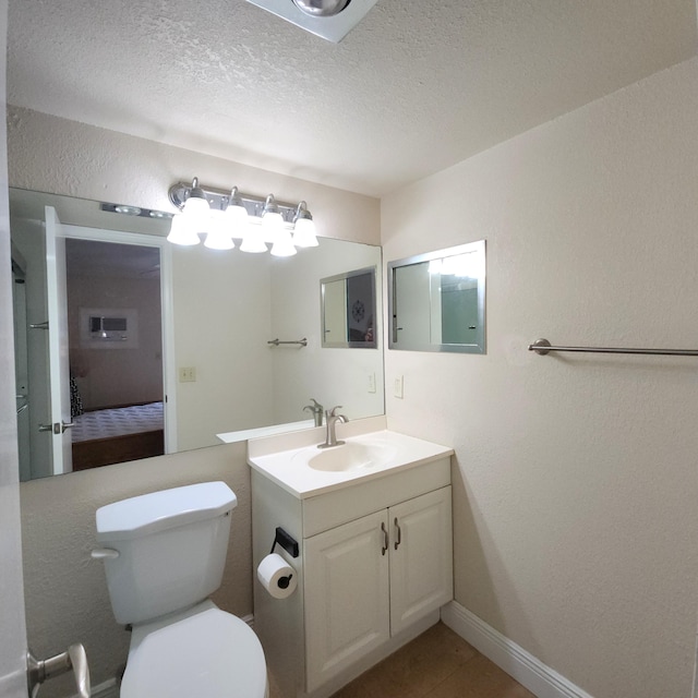 173 Kent J, West Palm Beach, FL 33417 - bathroom with vanity, toilet, a textured wall, a textured ceiling, and ensuite bath