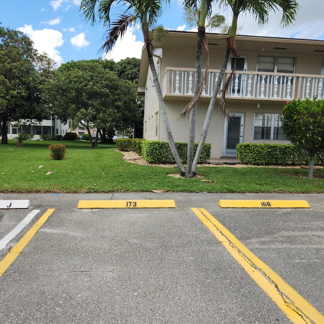 173 Kent J, West Palm Beach, FL 33417 - view of building exterior with uncovered parking