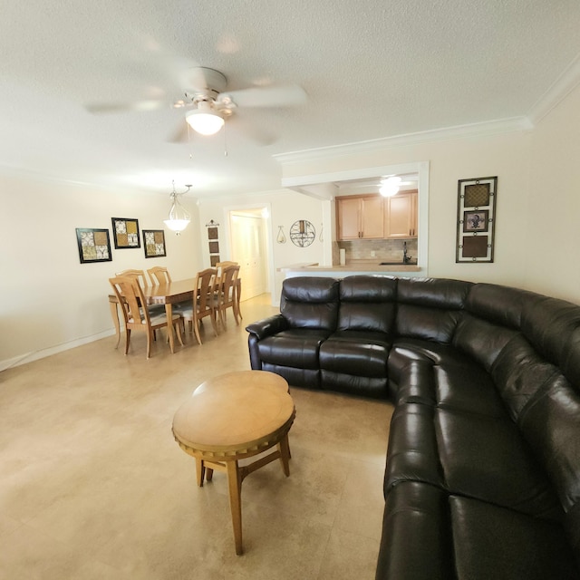 173 Kent J, West Palm Beach, FL 33417 - living area featuring a ceiling fan, a textured ceiling, and crown molding